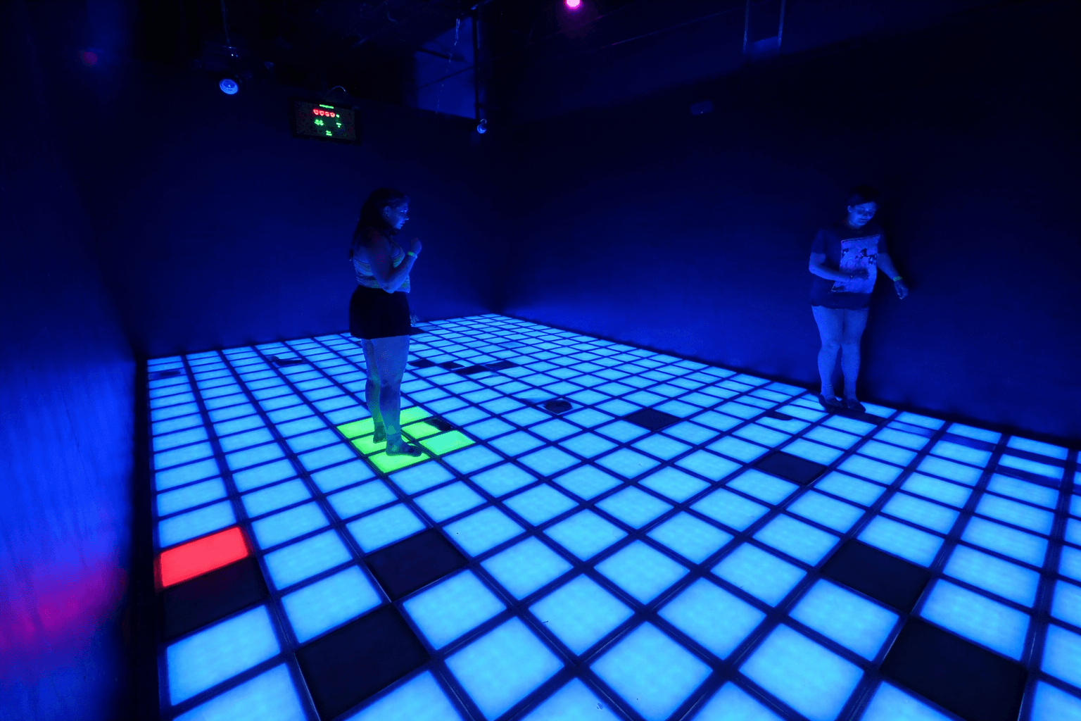 Players inside the Pixel Pulse floor challenge room